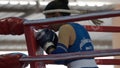 The woman boxer in the ring of thai boxing indoor have to practice first isÃ¢â¬ÅWaiKruÃ¢â¬Â.